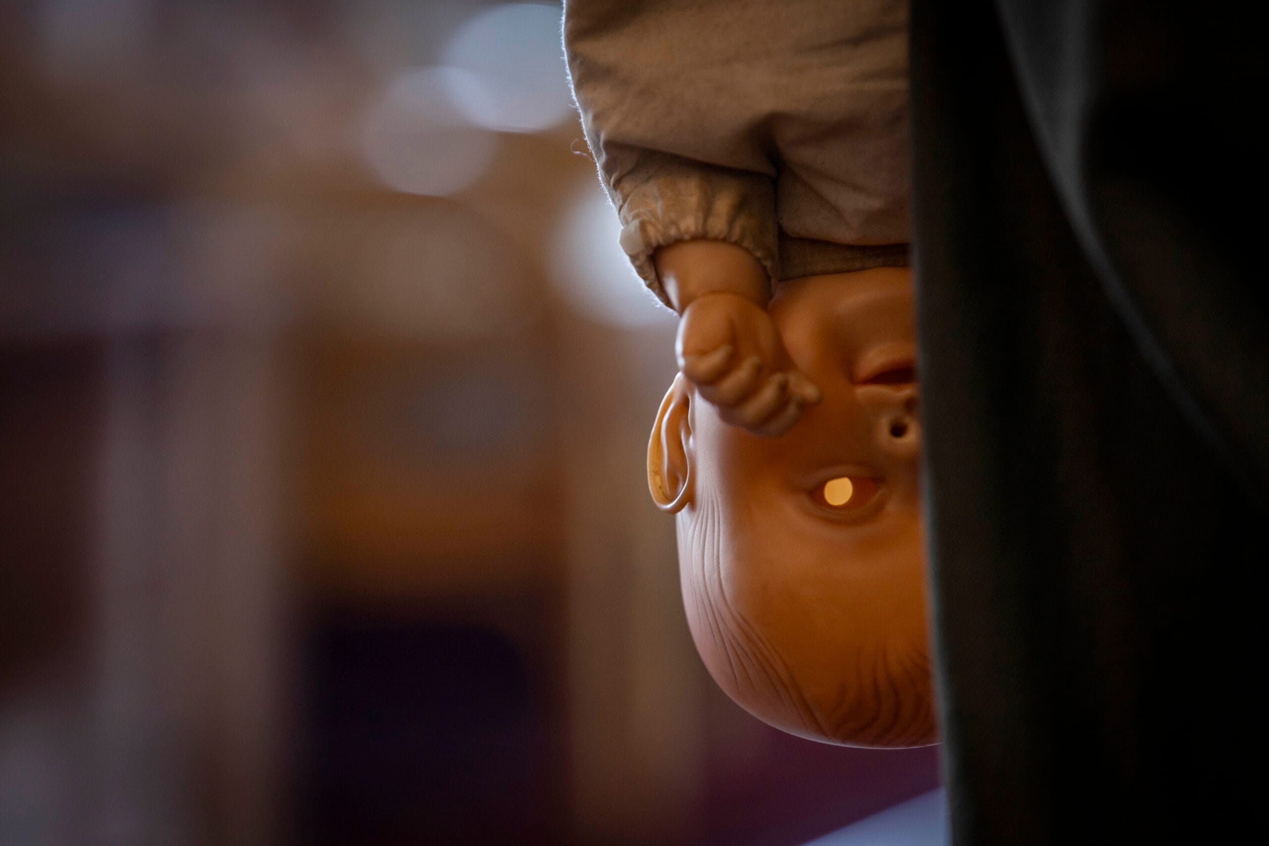 THE RULE OF JENNY PEN Still 2 scaled THE RULE OF JENNY PEN Review: John Lithgow (And Puppet) Are Absolutely Deranged in Retirement Home Psychological Thriller 11 THE RULE OF JENNY PEN (2025) close up shot of the jenny pen doll, upside down, staring at the camera with it's haunting hollow eyes
